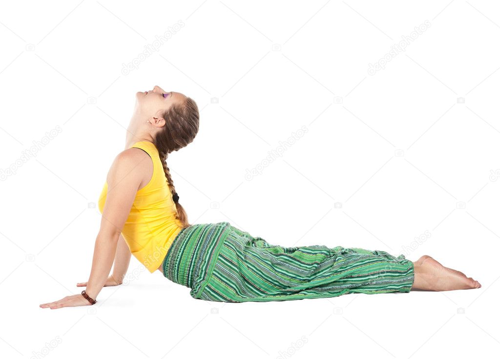 Beautiful girl doing cobra pose isolated in white background