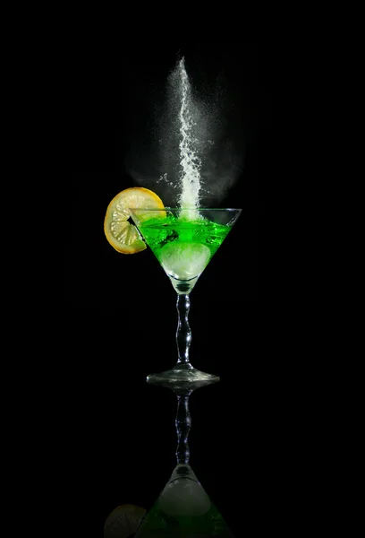 Glass of martini with lime and splashes — Stock Photo, Image