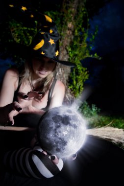 Witch with magic sphere clipart