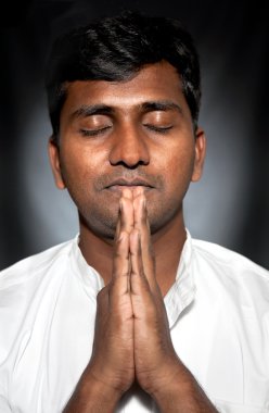 Indian man praying clipart