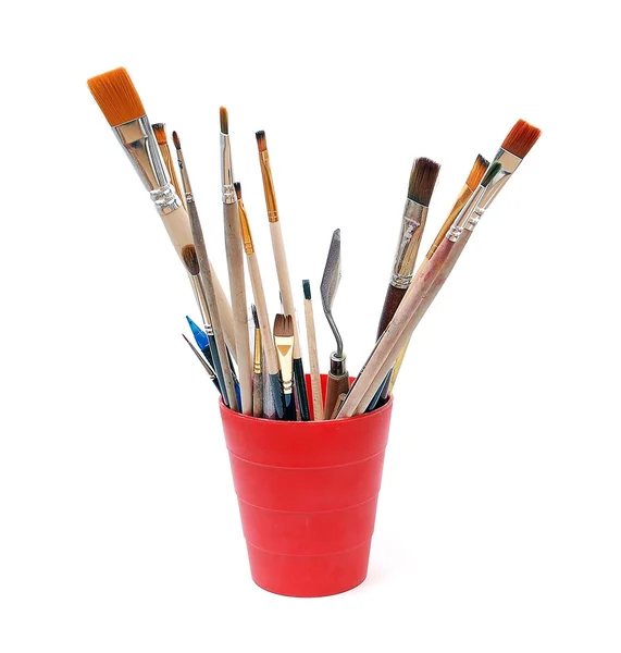 Red glass with brushes — Stock Photo, Image