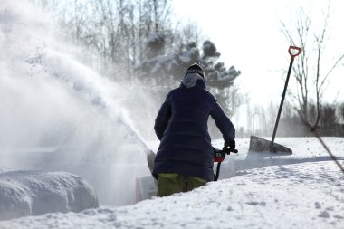 Snow blowing girl clipart