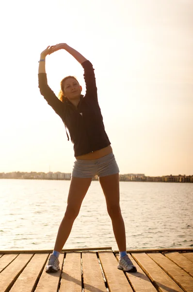 stock image Woman get fitness on sea