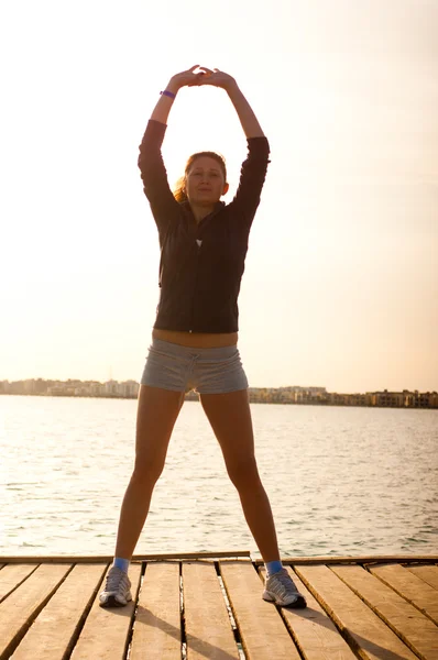 stock image Woman get fitness on sea