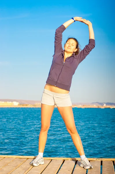 stock image Woman get fitness on sea