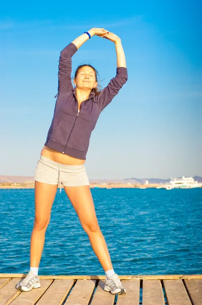 stock image Woman get fitness on sea