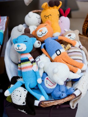 Stuffed animal toys in a basket clipart