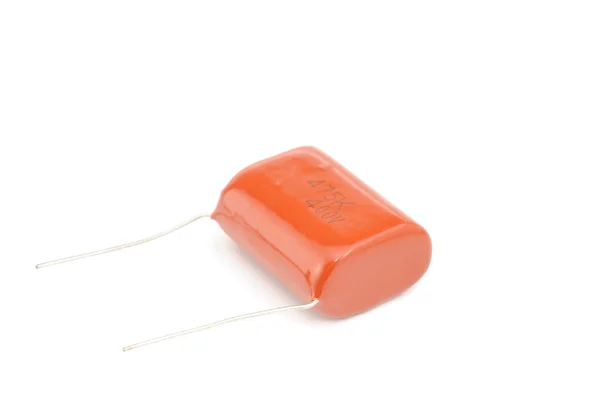 Pomarańczowy kondensator na białym tle — Zdjęcie stockowe