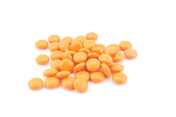 Oranje pillen geïsoleerd op witte achtergrond — Stockfoto