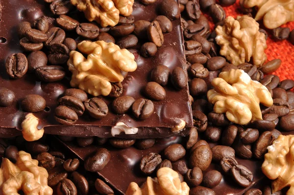 Black chocolate with coffee bens and nuts — Stock Photo, Image