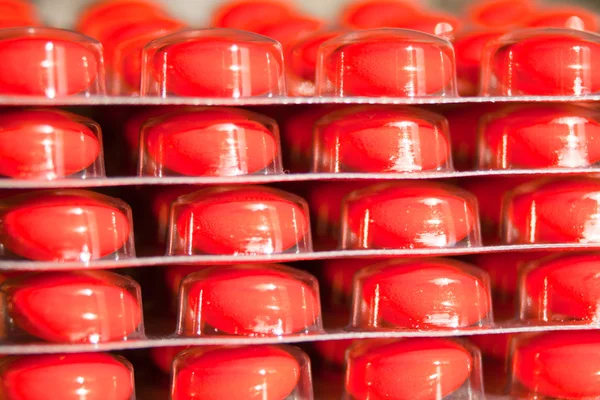 Червоні ліки на упакованих — стокове фото