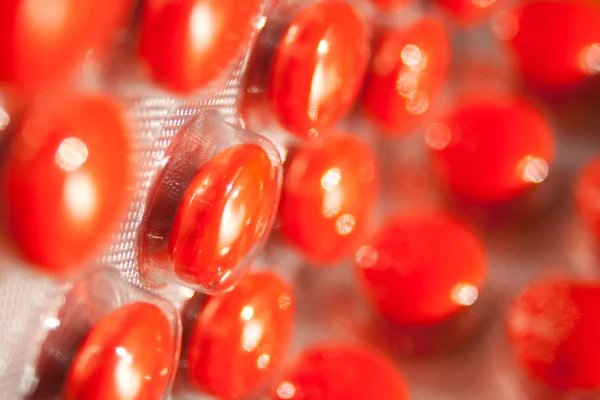 Red drugs on packed — Stock Photo, Image