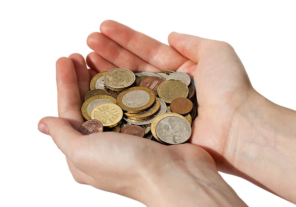 stock image Woman's hands holding a pile of different coins