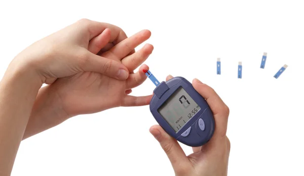 Woman checks glucose level in blood at the child — Stock Photo, Image