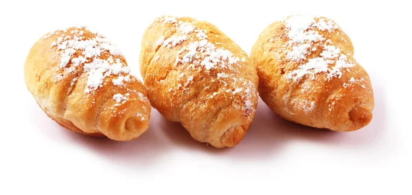 Croissant Mit Puderzucker Auf Weißem Hintergrund — Stockfoto
