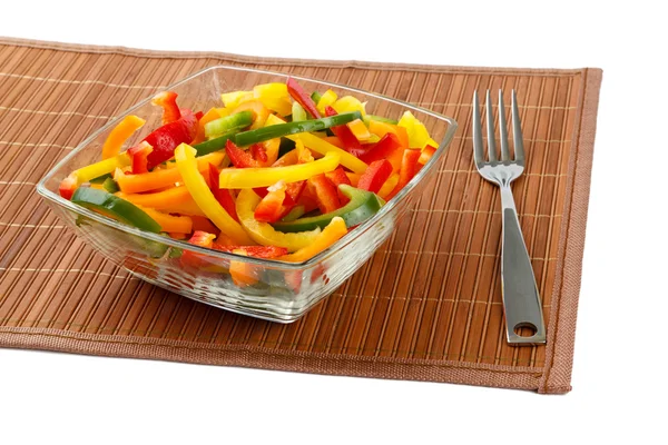 Mix of fresh vegetables from a color paprika in a glass plate — Stock Photo, Image