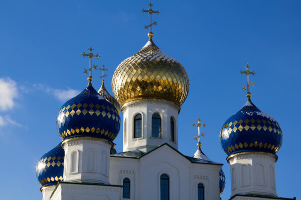 Sparkling domes of orthodox church against the blue sky in the winter, Bobruisk, Belarus