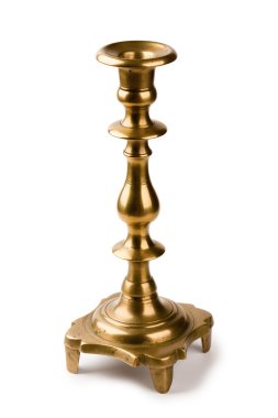 Ancient fine-molded brass candlestick for one candle isolated on a white clipart