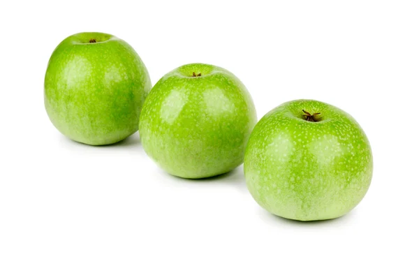 Three ripe and juicy green apples located in a line isolated on a white — Stock Photo, Image
