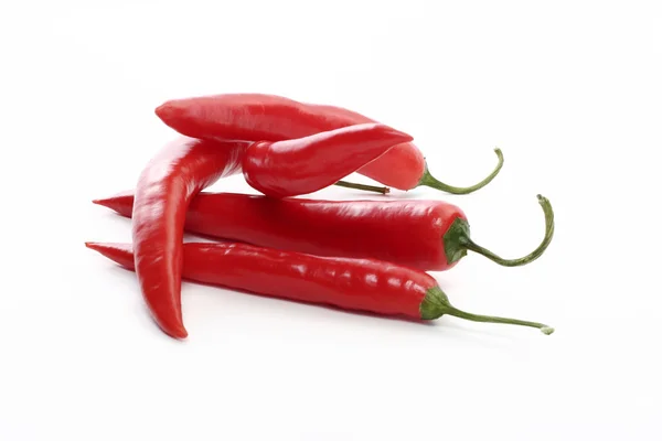 Red hot chili peppers on white — Stock Photo, Image