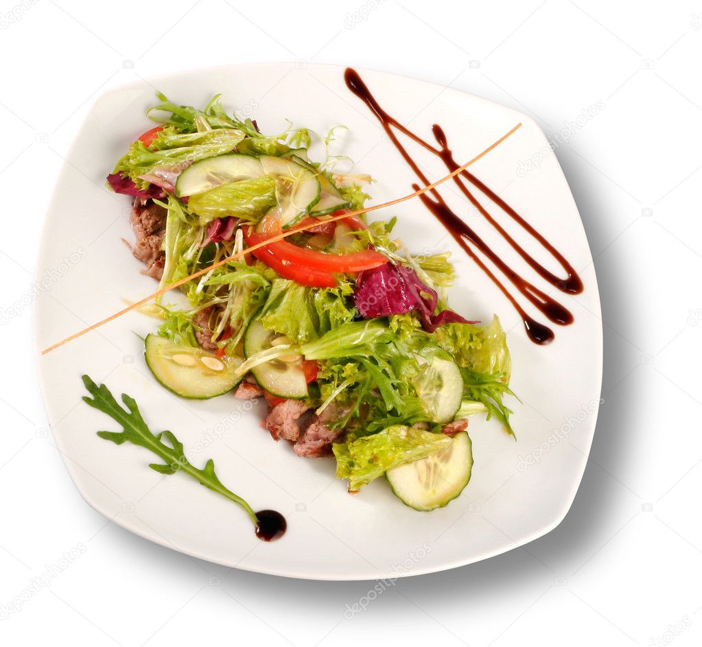 A plate of pork with vegetables. File includes clipping path for easy background removing