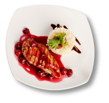 Delicious beef with cherry sauce. File includes clipping path for easy background removing clipart