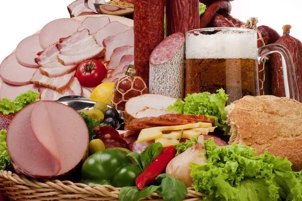 A composition of meat and vegetables with beer — Stock Photo, Image