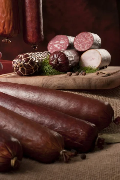 A composition of different sorts of sausages — Stock Photo, Image