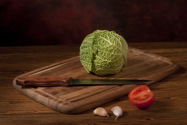 Green cabbage on wooden tablet — Stock Photo, Image