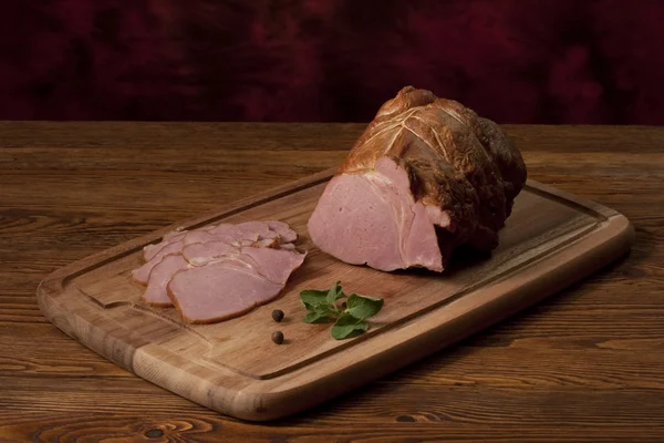 Smoked ham on the table — Stock Photo, Image