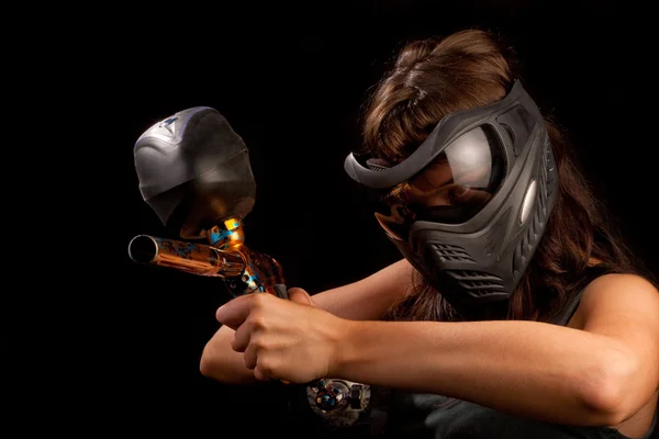 stock image Image of a paintball player in protective helmet aiming the target