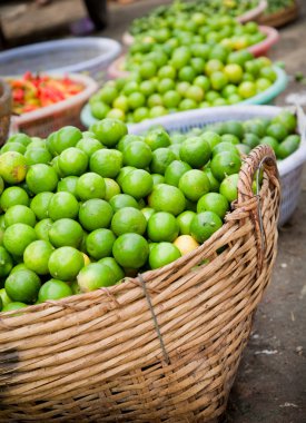 Fresh Organic Limes Piled In Boxes At Farmers Market clipart