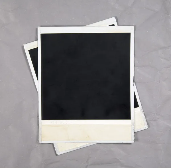 Molduras de fotos em fundo de papel — Fotografia de Stock