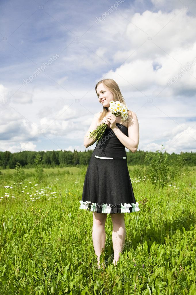 Young Woman With Flowers Outdoors