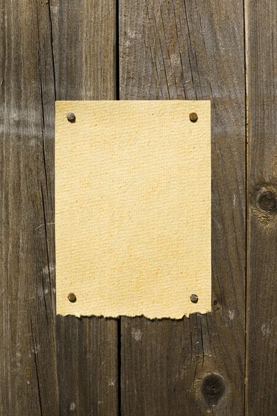Bamboe papier op donkere houten textuur — Stockfoto