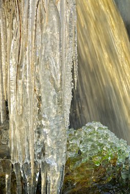 Waterfall accompanied with icicles. clipart