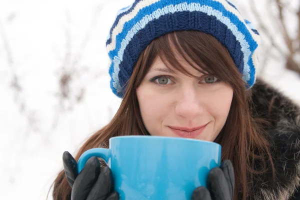Young Woman Striped Hat Gloves Smiling Holding Blue Cup — Stock Photo, Image