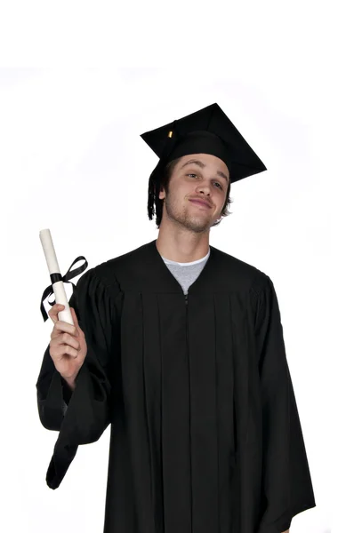 Teenager holding diploma in gown — Stok fotoğraf