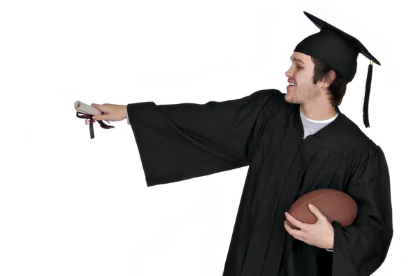 Diplomás holding labdarúgó és mutató Stock Kép