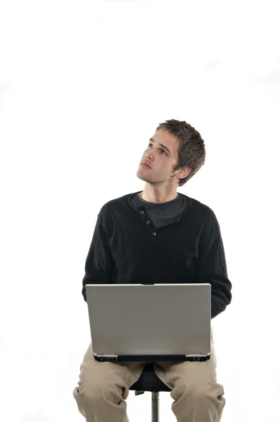 Adolescente Sentado Banquinho Com Laptop Olhando Para Cima Fundo Branco Fotos De Bancos De Imagens Sem Royalties