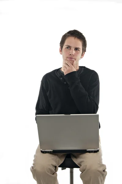 Adolescente Sentado Banquinho Com Laptop Profundo Pensamento Sobre Fundo Branco Fotografias De Stock Royalty-Free
