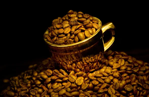 Gold cup of coffee — Stock Photo, Image