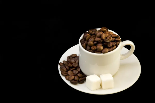 White cup with coffee beans and shugar — Stock Photo, Image