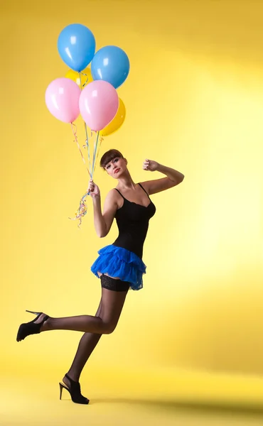 漂亮女人与气球贴图样式 免版税图库照片