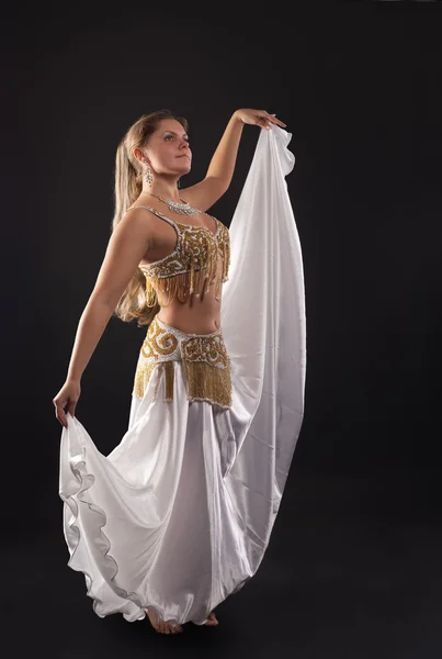 Young woman dance in dark - white arabian costume — Stock Photo, Image