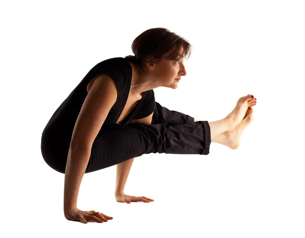 Mature woman stand on hands in yoga pose — Stock Photo, Image