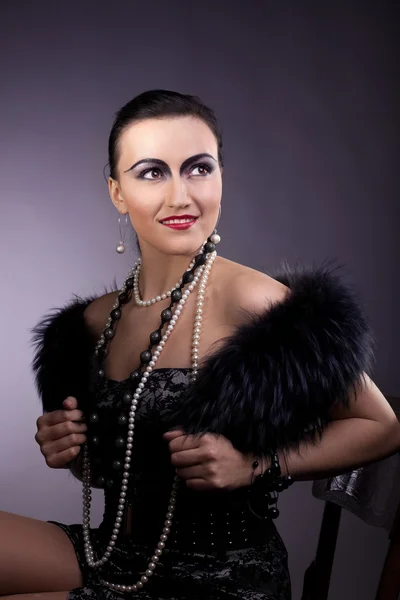 Woman smile in fur boa and pearl beads — Stock Photo, Image