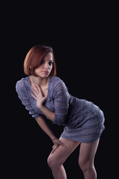 Young brunette posing in grey dress — Stock Photo, Image