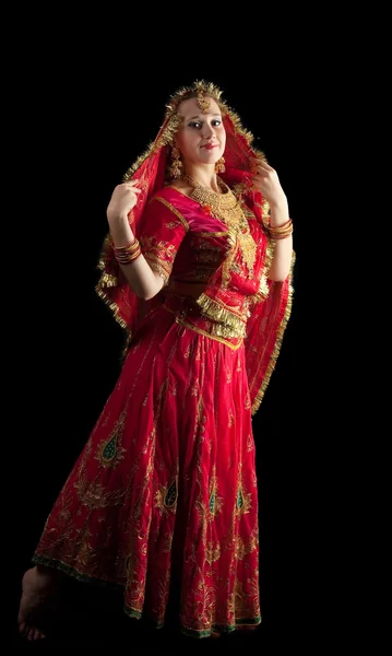 Young girl dance in red indian oriental costume — Stock Photo, Image