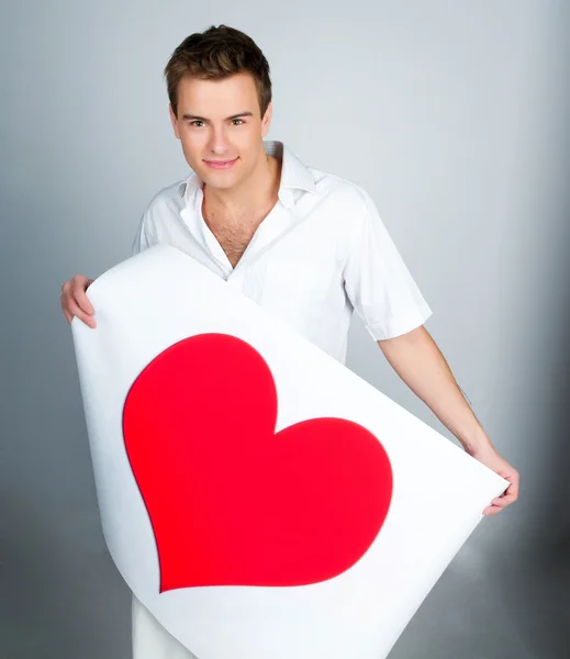 Man holding a red heart — Stock Photo, Image